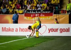 Swedish footballer preparing to take a corner