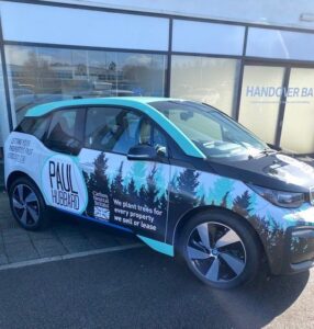 A card branded with Paul Hubbard colours and logos