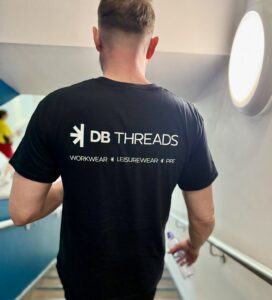 A man wearing a DB Threads T-Shirt
