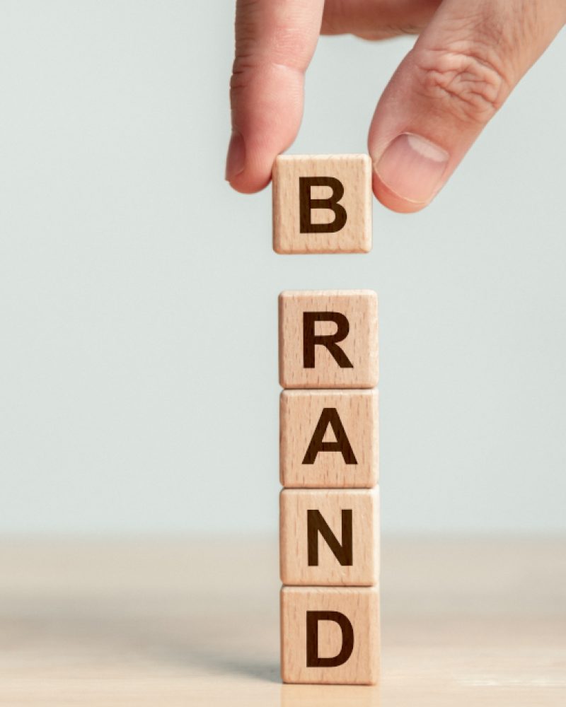 Image of scrabble tiles spelling brand next to informational text