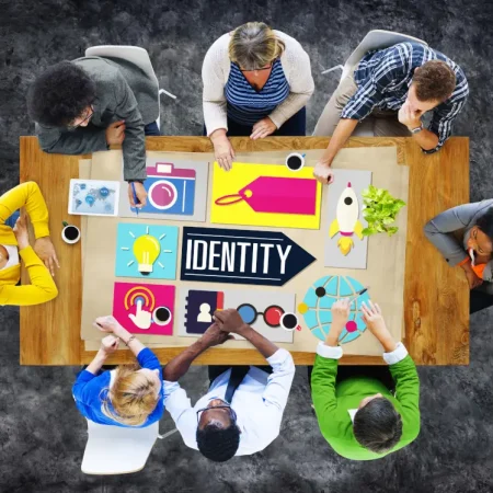 Image of staff around a table for the DB Group Difference section
